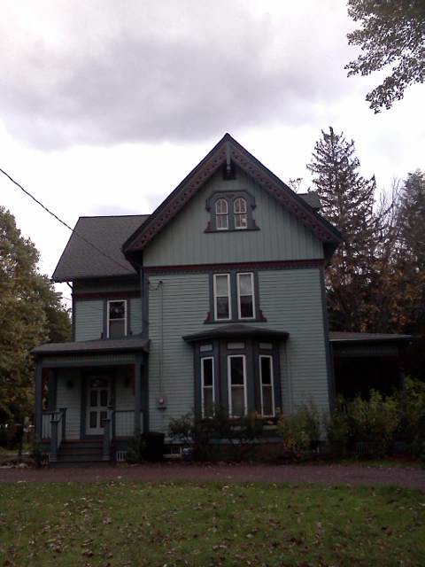 House exterior with siding and paint work showing professional home improvement